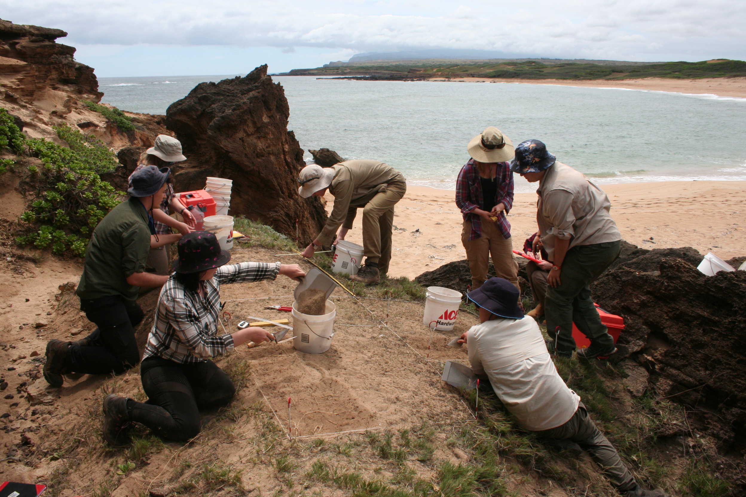 UQ students excavating an ancient site just above a pristine beach along the rugged, windward coast of Moloka‘i, Hawaiian Islands.